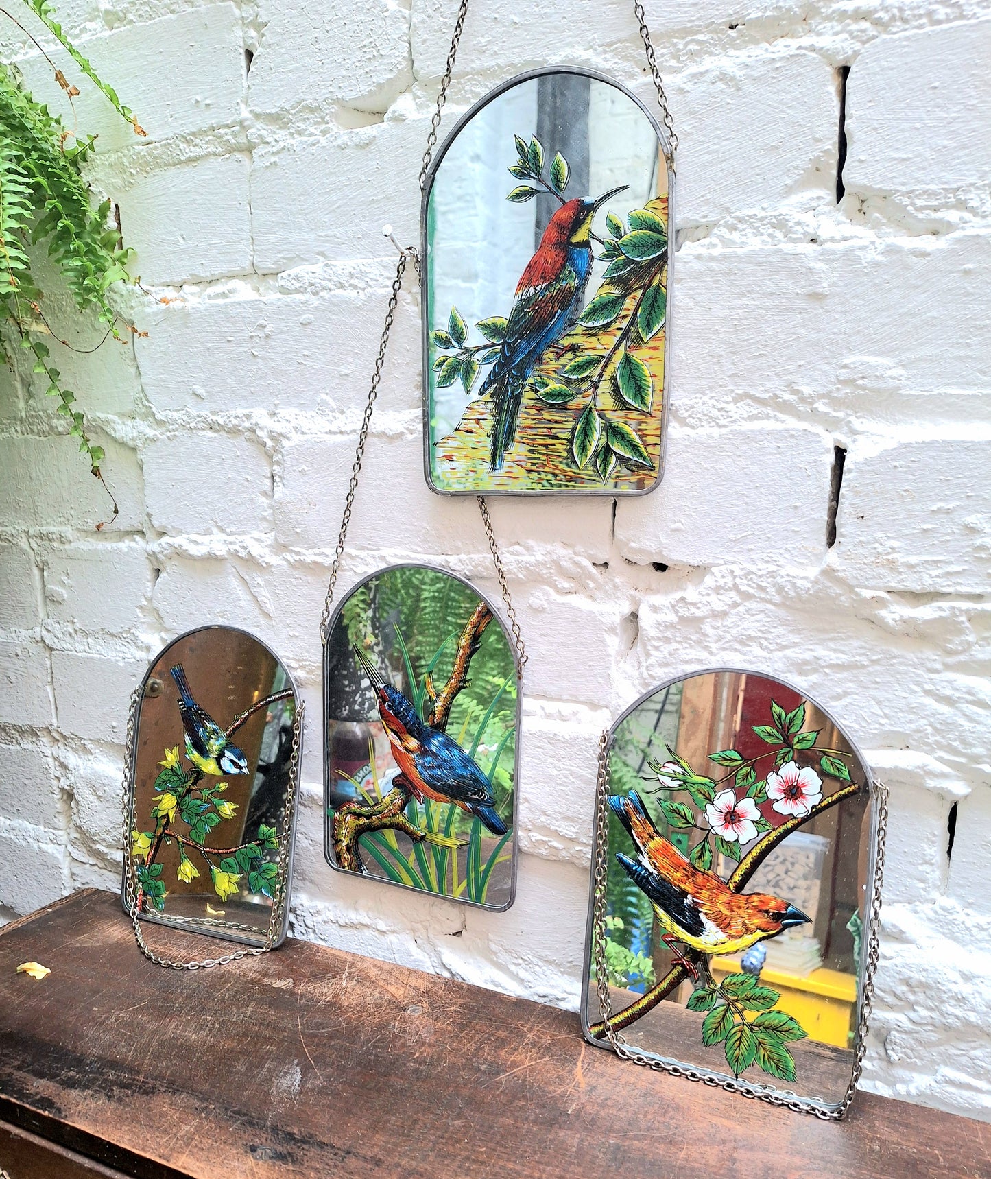 Vintage Set of Four Handpainted Hanging Bird Mirrors.